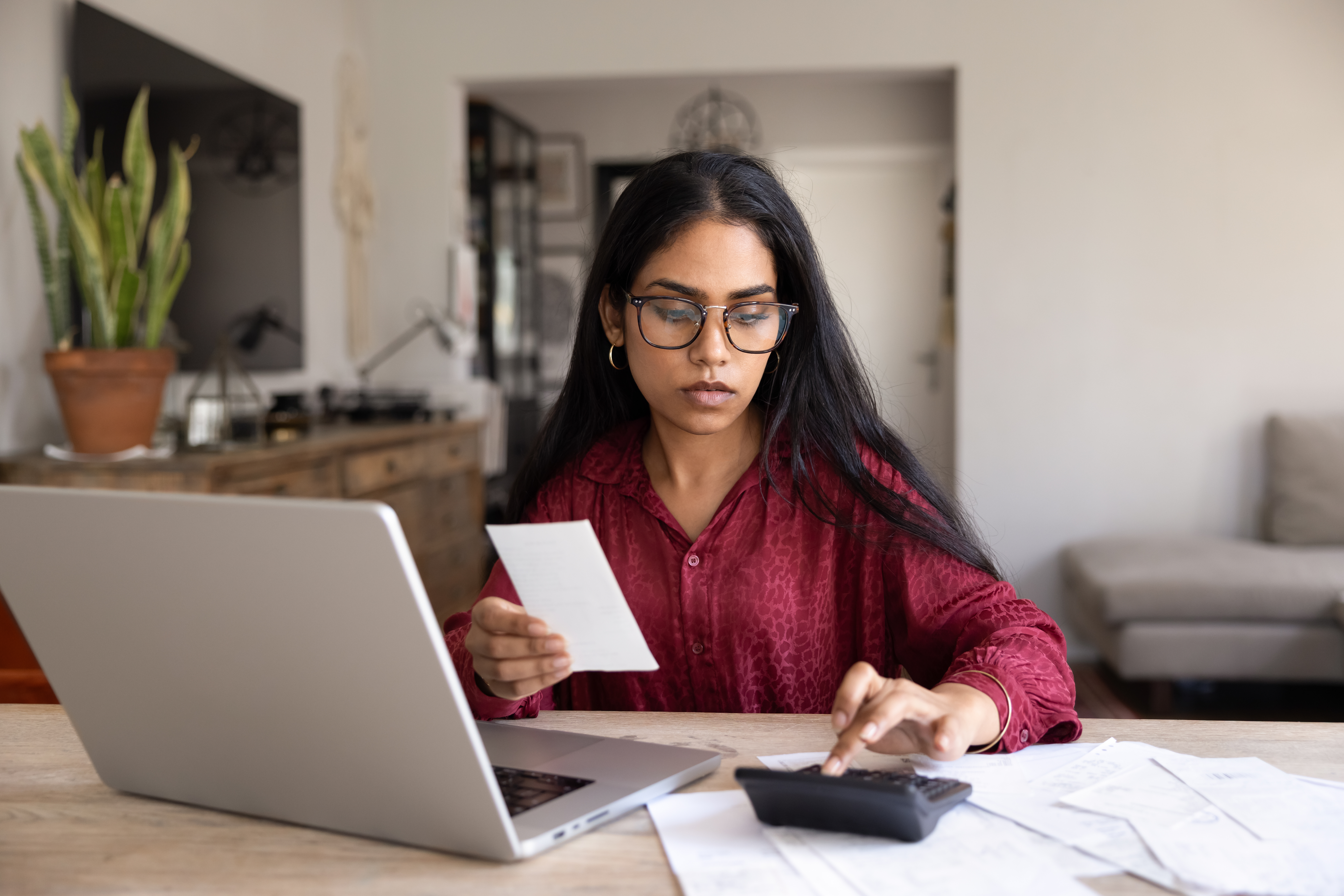Account holder reviewing finances at a laptop